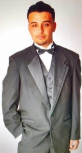 Image of Michael Posing in a Tuxedo