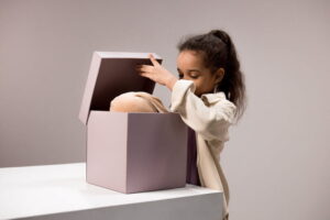 A young girl opens a present