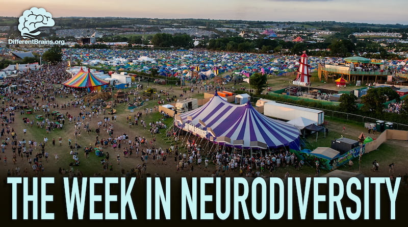 A bird's eye view of the Glastonbury festival, showing a large crowd of people over a large area, with the tops of tents and buildings visible.
