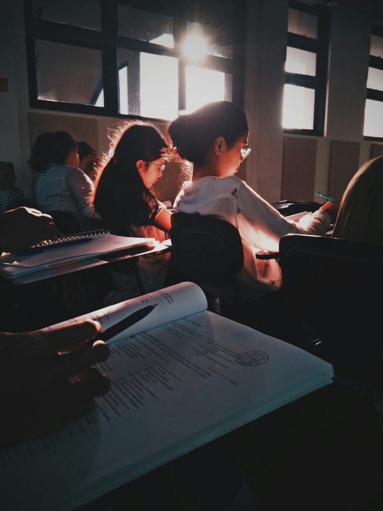 Students in a classroom take a test